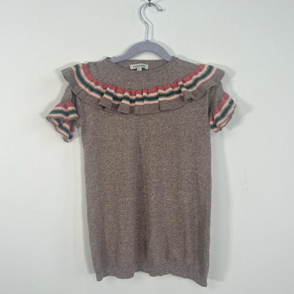 Caramel cotton knit girls’ dress with ruffle details. Size 4y.